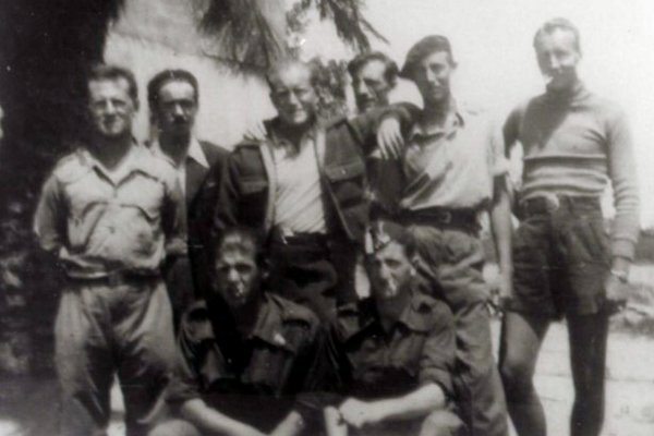 Delmer Berg, standing second from right wearing a beret, with the Abraham Lincoln Brigade in Spain around 1938. Credit Abraham Lincoln Brigade Archives